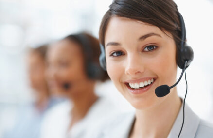 Closeup of a beautiful business customer service woman smiling